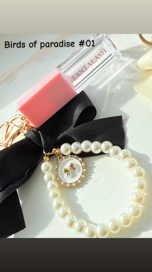 Lip oil bow bag charm